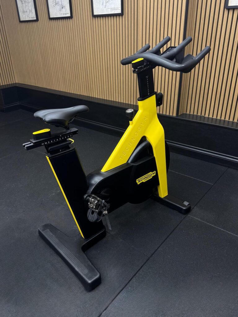 Technogym Group Cycle Ride (D92RNEDL) covered flywheel Yellow